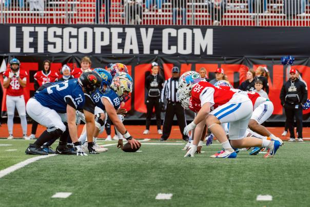 football players set at the line of scrimmage