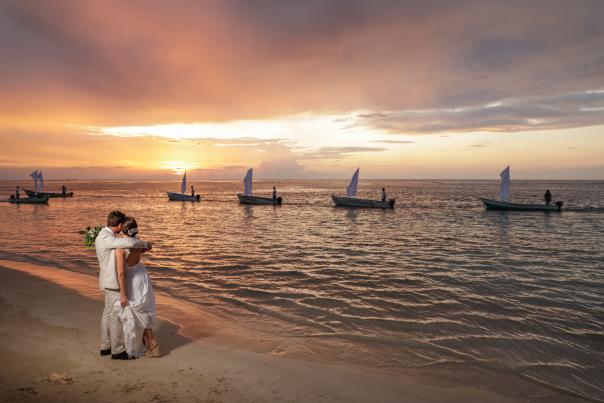 Wedding couple on the beach at sunset