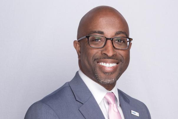 timothy bush, black man in suit, smiling in professional headshot photo