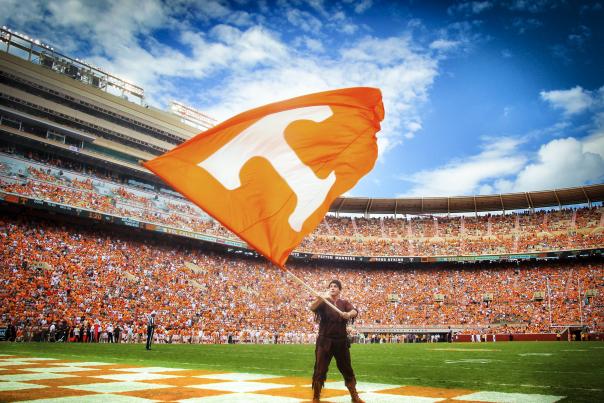 A man waves a giant "T" flag during a University of Tennessee football game