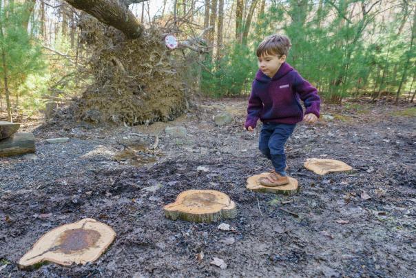 A little boy enjoys Lilliana's Nature Area at Kettle Creek in the Poconos.