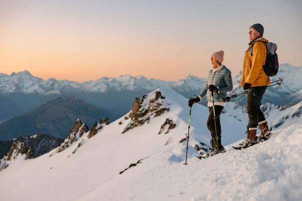 Couple snow shoeing at sunset on Mt Larkins near Glenorchy