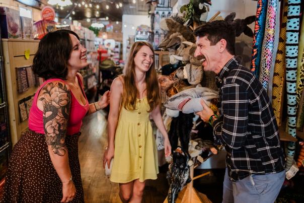 A family plays with a shark puppet at Got Toys in Downtown San Marcos