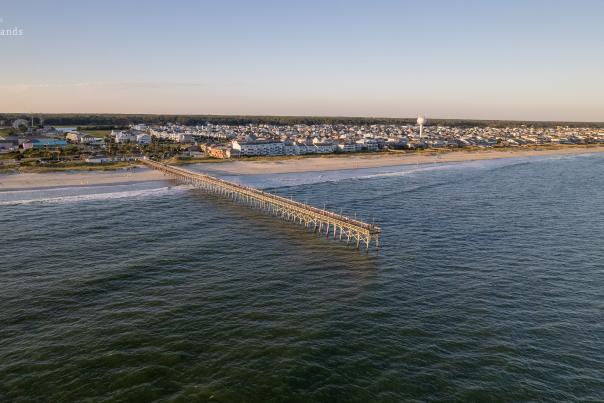 an aerial view of Ocean Isle Beach and the pier