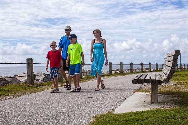 Family walking along path at Fort Fisher State Recreation Area in Kure Beach, NC