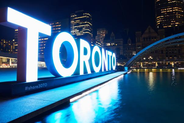 The Toronto Sign at Nathan Phillips Square lit blue