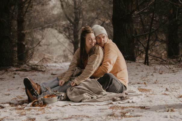 Couple in snowy woods