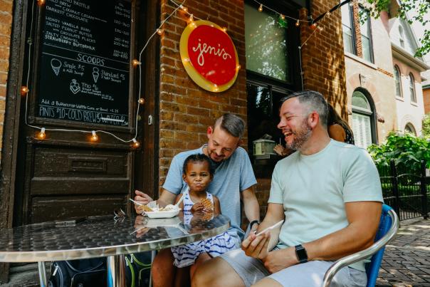 Two fathers and daughter enjoying ice cream at Jeni's Splendid Ice Creams in German Village