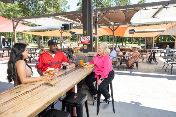 Image of two ladies and a male enjoying beers at Dirtbag Ales Brewery & Taproom