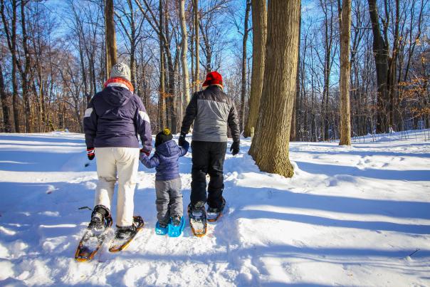 Family snowshoeing together in Grand Rapids, MI