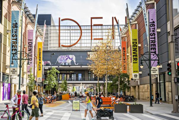 People walking outside the Denver Pavilions on the 16th Street pedestrian promenade.