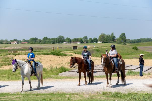 Three horses and their riders at the Three Rivers Horse Trail