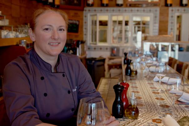 Chef Nancy Alip behind the bar at Jens Restaurant