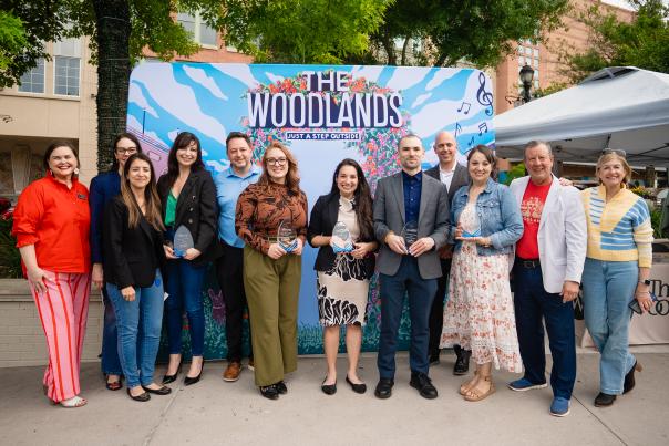 For National Travel and Tourism Week, Visit The Woodlands poses with their Hospitality Award Honorees. From left: Elizabeth Eddins, (unsure), (unsure), Cassondra Woodburn, (unsure), Bethany Ables, Ilyssa Burkowitz, Guillermo Pereira, (unsure), Katrina Lockler, Nick Wolda, and Linda Nelson.