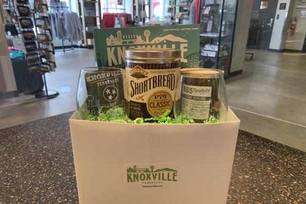 Visit Knoxville Gift Box with wine glasses, shortbread, and candles