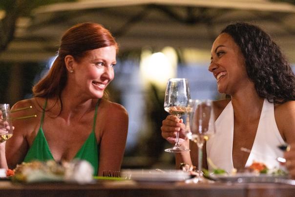 Two women enjoying a meal at Magnolias on the Bay in Englewood, Florida