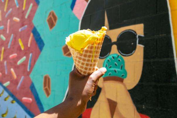 Chocolate Moose ice cream cone held in front of their mural