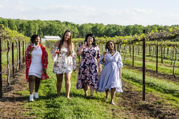Ladies walking through a vineyard