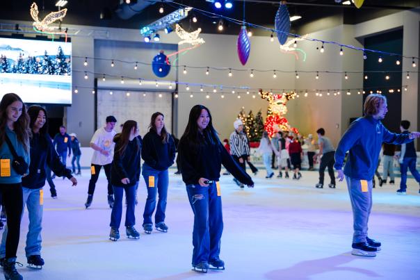 Kids, teens, couples, and families skate around The Woodlands Ice Rink.