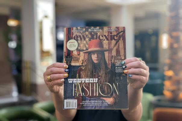 Person holding a copy of the September 2024 edition of New Mexico Magazine, titled "Western Fashion"