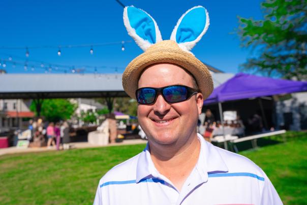 A man wears bunny ears atop his straw hat at the Mandeville Trailhead Community Market's annual "Easter at the Market" event.