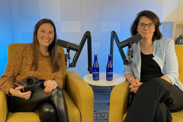 Two women sitting in podcast studio