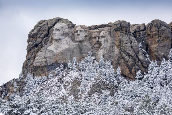 Mount Rushmore covered in frost during the winter season