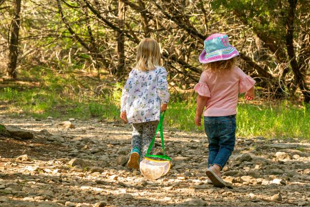 Two little girls walking down trails