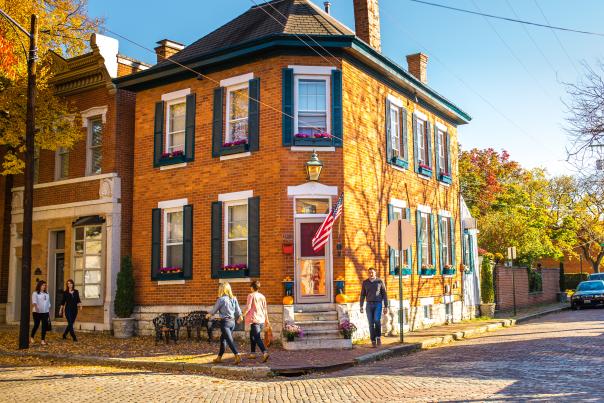 People walk in Columbus' German Village neighborhood in the fall