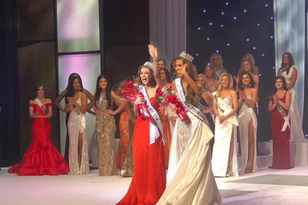 pageant winners are crowned and waving at the audience