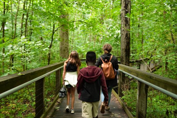 Family on trail through the Lindenwood Nature Preserve