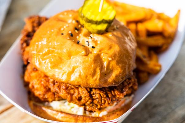 Fried chicken sandwich topped with pickles
