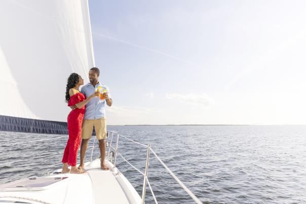 Couple toasting on a sailboat in Charlotte Harbor, Florida