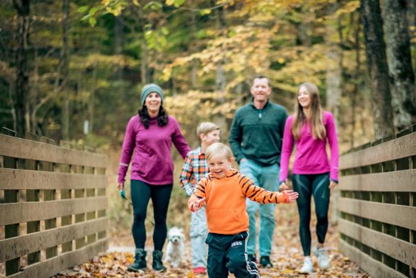 family on a trail in the fall