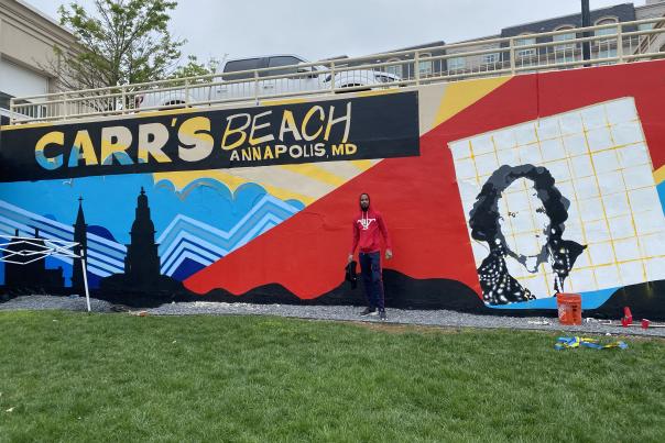 Comacell in front of the Carr's Beach mural at MC3