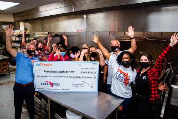 2020 Magical Dining check presentation to Feed the Need charity
