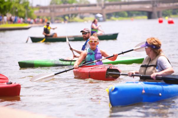 Boy on river in kayak Riverfest