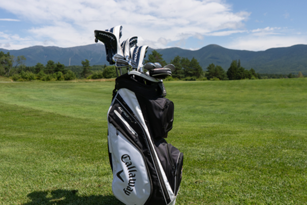 Golf bag in front of a view of Mount Washington
