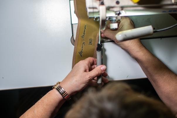 Close-up of a sewing machine making a Stormy Kromer at the factory in Ironwood, MI