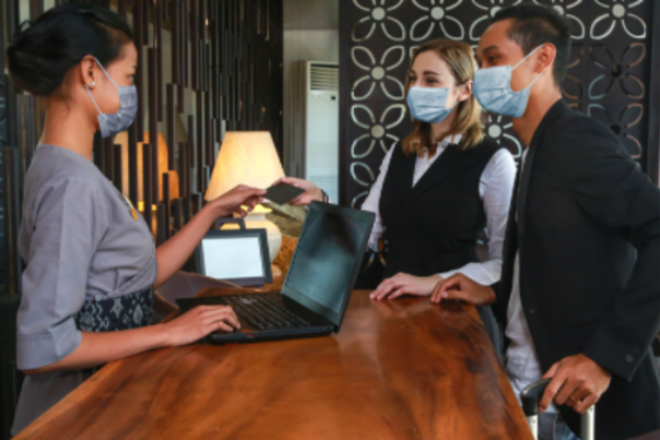 Masked Hotel Desk Staff