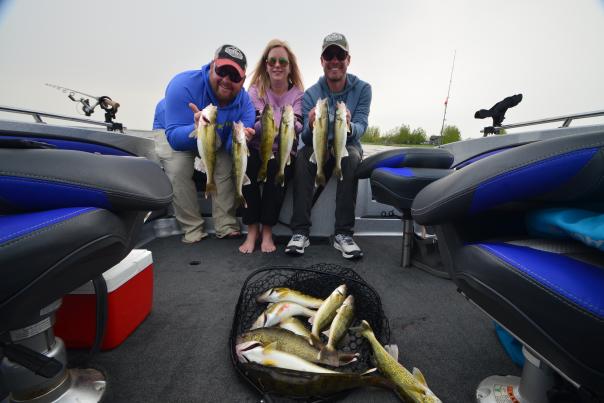Three friends holding walleye on Devils Lake, ND