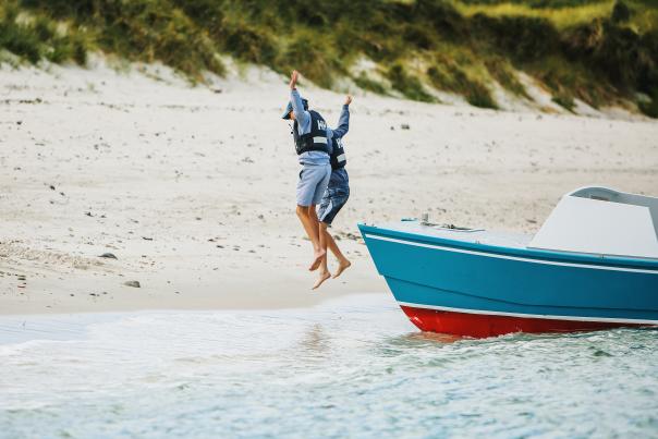 Kids jumping off boat