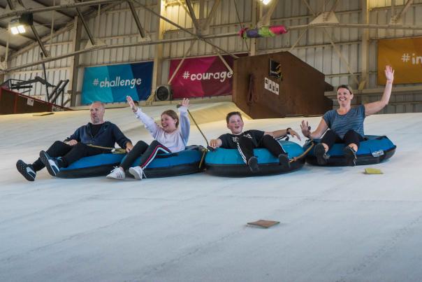 Family in ringos at indoor slope at Calshot Activities Centre in the New Forest - Activities