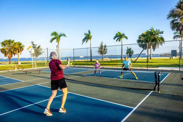 Four people playing pickleball at Gilchrist Park in Punta Gorda, FL