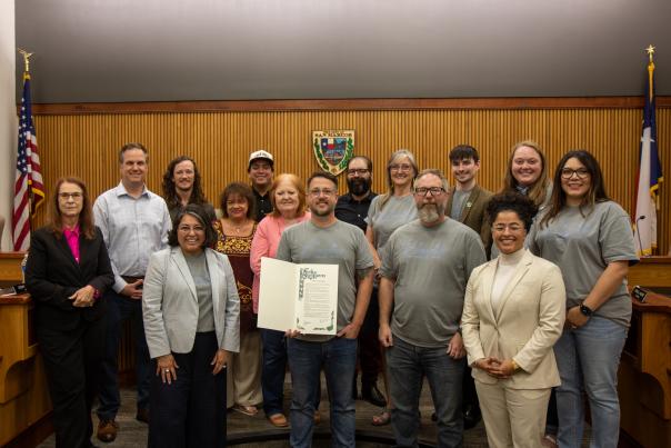 A group photo was taken after the reading of the National Travel & Tourism Month Proclamation read by San Marcos' Mayor Hughson. San Marcos marked the occasion by highlighting the travel industry's vital role in the city's economy and quality of life.