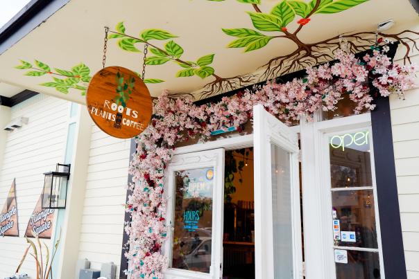 The inviting entrance of Roots Plants + Coffee in Olde Towne Slidell.