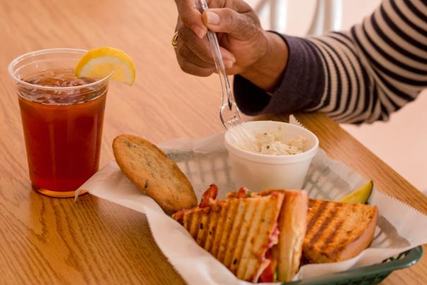 Person eating deli food
