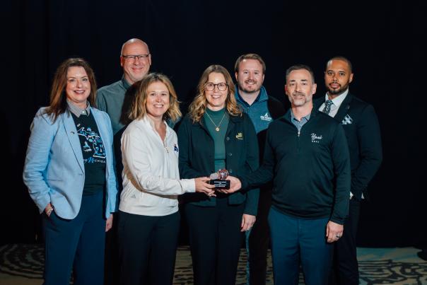 Destination Ann Arbor posing with the Pure Michigan collaboration award