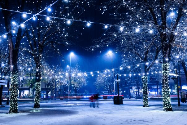 A plaza with lights in the snow