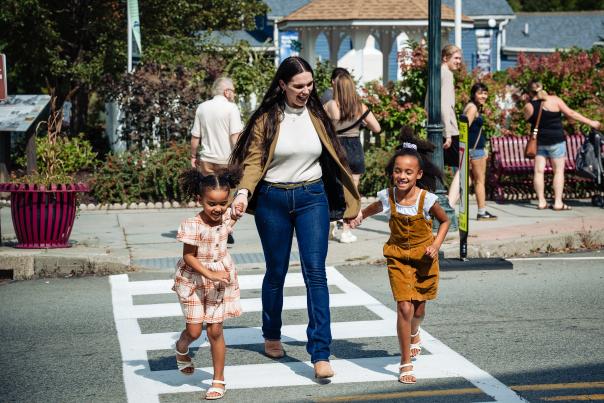 A mom and two kids enjoy a small town stroll in Hawley, Pennsylvania.